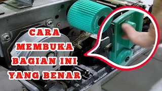 Melepas handle fixing unit 1 mesin fotocopy secara benar dan tepat