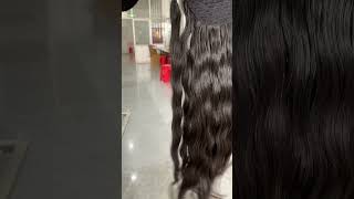 Human hair ponytail in natural wave