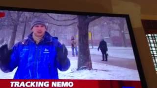 Guy with yellow flag on winter storm nemo