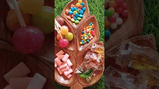 Lot"s of candies-- Different candies filling wooden leaf platter #yummy #viral #tasty #asmr #shorts💕