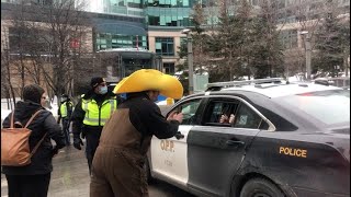 RAW: OPP officer appears to allow protesters to pose in back of vehicle