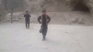 A small Afgan boy dance