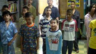 @ orphanage _ teach kids to sing "Que Sera Sera" song