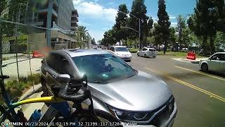 Driver drives off after hitting bike and bike rack