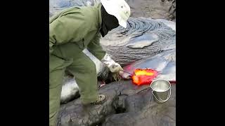 This is how geologists collect samples of lava from an active volcano