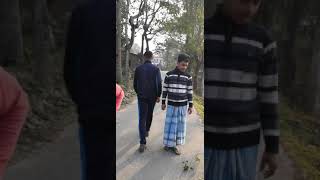 Kids putting warning signs for passerbys on the road inside a massive hole