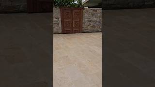 Travertine paving, Earthy tones. #paving #landscaping #doors