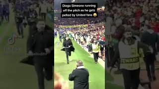 #Diego_simeone running off the pitch as he gets pelted by #United fans #Manchester united #Atletiko