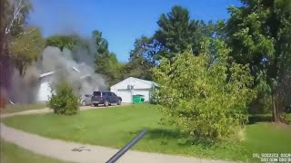 Police kicks down door to save family from burning Home