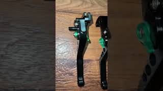 Black and green levers