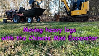 Moving heavy logs with the Chinese mini excavator