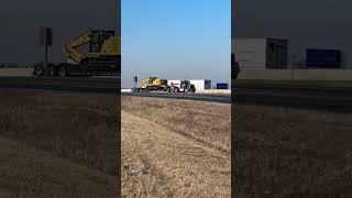 #shorts Heavy duty Kenworth hauling Cat excavator on lowboy drive by