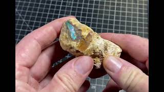 Looking at an unusual ironstone formation with opal