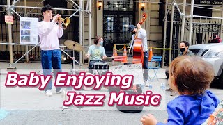 Baby enjoying live jazz music in NYC, Earth Day Celebration, 4K Ultra HD