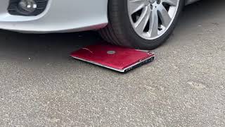 Running over my new MacBook Pro with my car