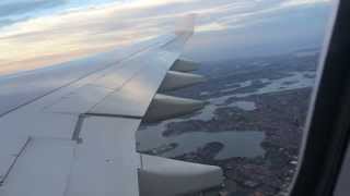 Plane taking off over Sydney (passenger view)