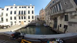 Pushing a touring bicycle through Venice.