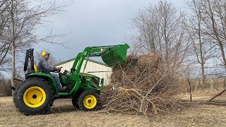 Clean up with the John Deere 3038E getting ready for spring