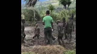 Playing Rugby in The Mud - PNG style