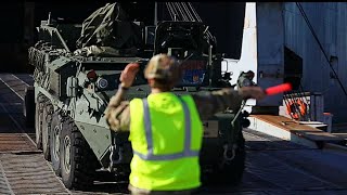 A convoy of military vehicles disembarks from a ship at Gwangyang port, Republic of Korea