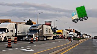 Driving Along The Highway Beside Trucks And Trailers