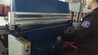 Leather belt embossing machine with automatic sliding table