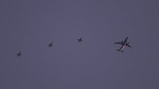 Royal Canadian Air Force CC-150T Polaris and x3 CF-18 Hornets flying over