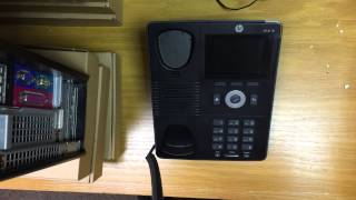 How to lift the handset of an IP telephone.