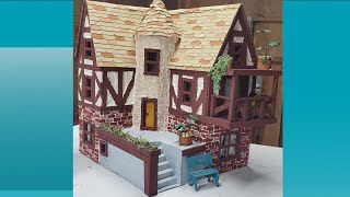 Mix of Scrap Wood and Cardboard to Create this House