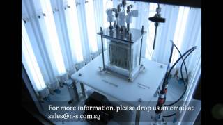 Lab scale bioreactor with integrated solar panel cell