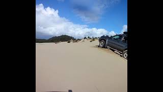 Speed is your friend when your driving trucks on sand dunes.