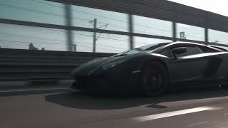 Black lamborghini on the road