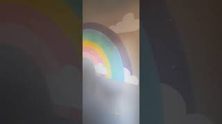 rainbow painting with clouds and sparkles