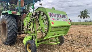 John deere 5045 d 4wd tractor with Kartar super deluxe baler in field