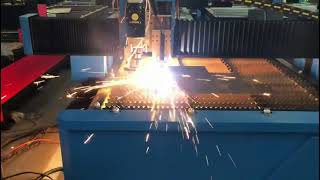 Plasma cutting machine with a rotary and a drilling head.