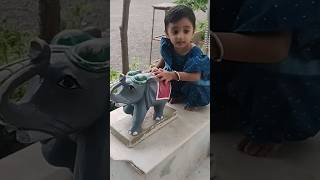 baby playing with 🐘 statue elephant in Khodiyar Mataji's temple