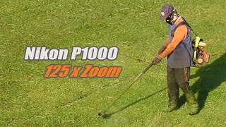 Nikon P1000 - Grass cutting man: Zoom 125x