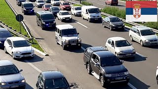 Police Convoy on the Highway During Rush Hour