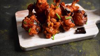 Chicken Lollipop-Crispy fried chicken coated with a hot & sweet garlic sauce is a great appetizer!