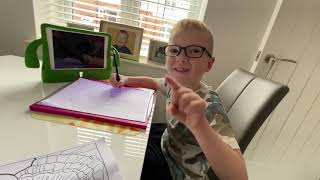 Finley tracing PENNYWISE with a Crayola  light up tracing pad.