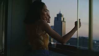 Women Leaning On A Window Sill Laughing And Taking Selfies   Stock Video Footage