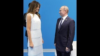 Melania towers over Putin