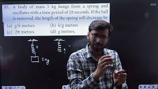 A body of mass 3 kg hangs from a spring and oscillates with a time period of 2pie second . If ......