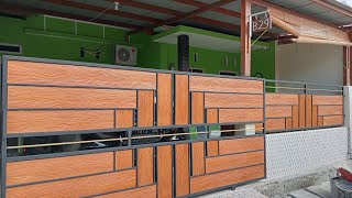 pintu pagar minimalis motif serat kayu.