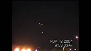 2004-11-03 Triangular UFO and another smaller one over houses in the United States