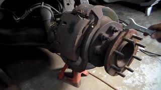 How to remove a front rotor 2001 dodge ram 3500 dually pt1 of 3