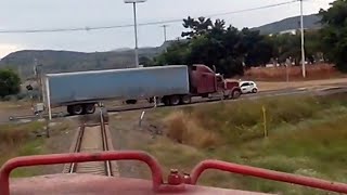 FXE locomotive nearly collided with the truck at the crossing way