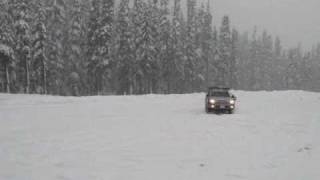 4th Gen V8 Toyota 4Runner doing snow burnouts in an empty ski lodge parking lot