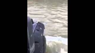 Jeep crossing flooded creek