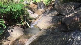 Man made creek waterfall